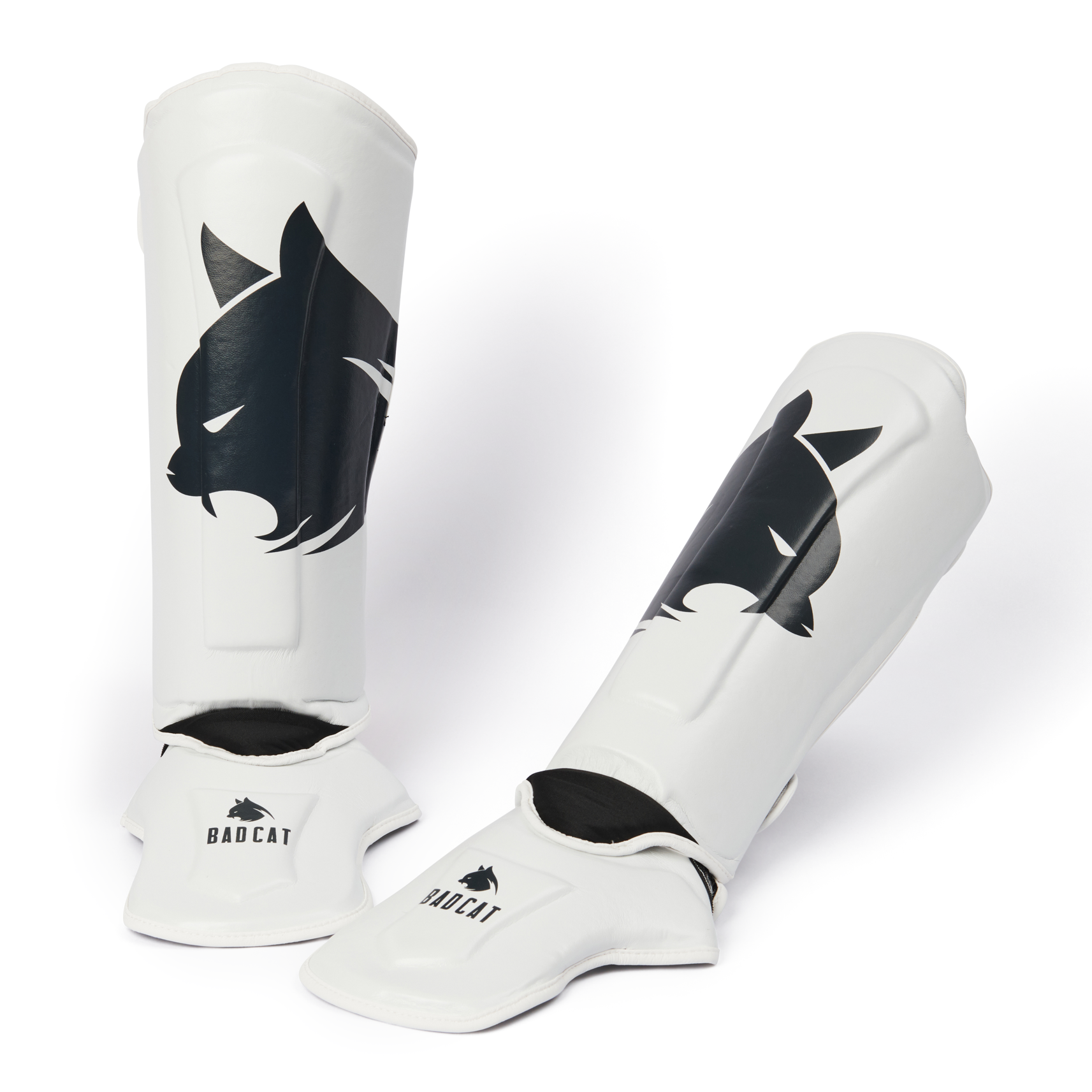 White shin guards with BAD CAT logo on a white background