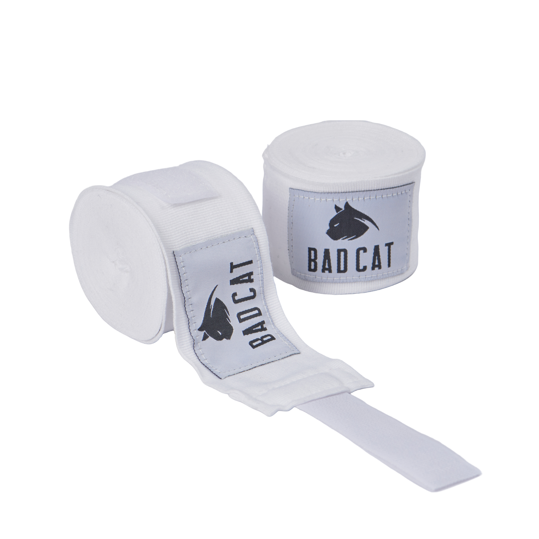 A pair of white hand wraps with 'BAD CAT' logo printed in gray on the strap.
